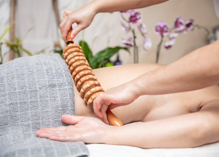 maderotherapy-anti-cellulite-massage-with-wooden-roller-massager.jpg